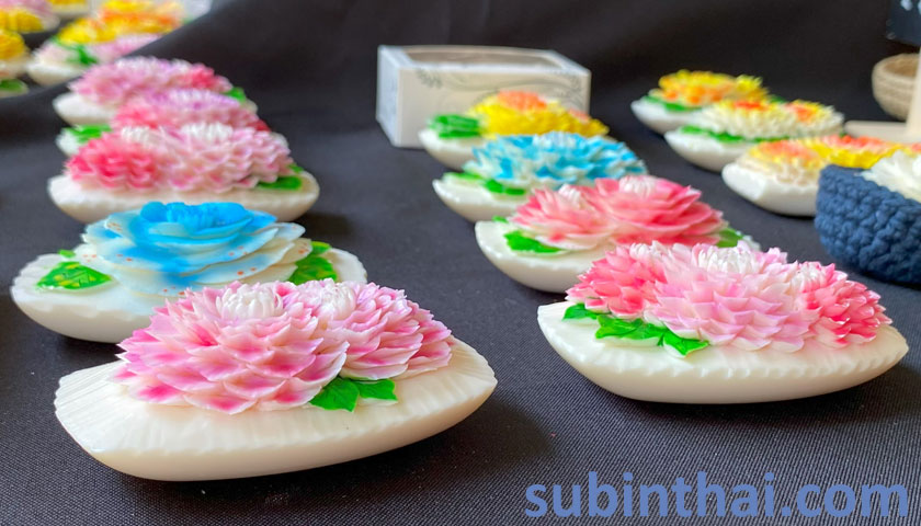 Close-up view of the colorful flowers carved from soap by Subin's Hand-Carved Soap Flowers.