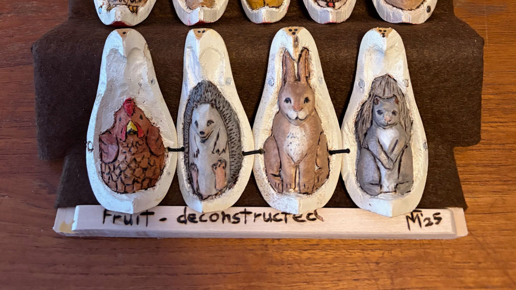 An open pair with animals carved inside by Theda Mobley