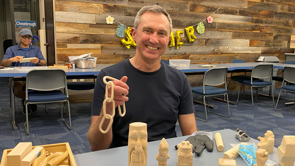 Tom shows his woodcarving projects, including a wooden chain.