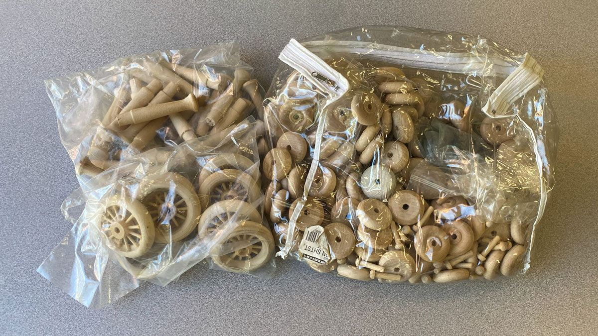 Bags of small wooden wheels.