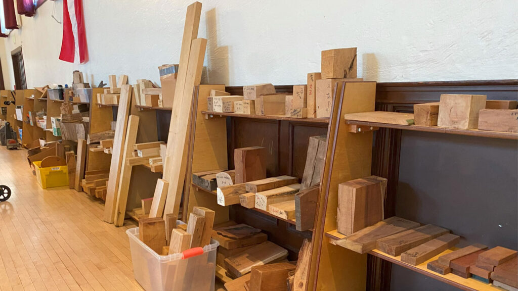 Several shelves full of wood blocks of various sizes for sale.