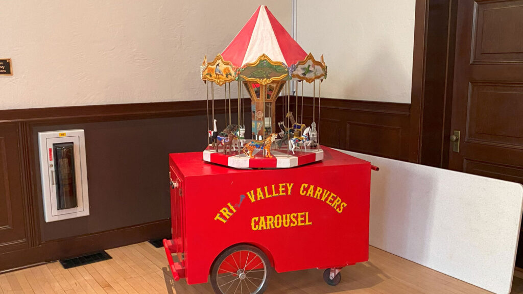 Tri-Valley Carvers Carousel on a cart. The Carousel featured carved animals.