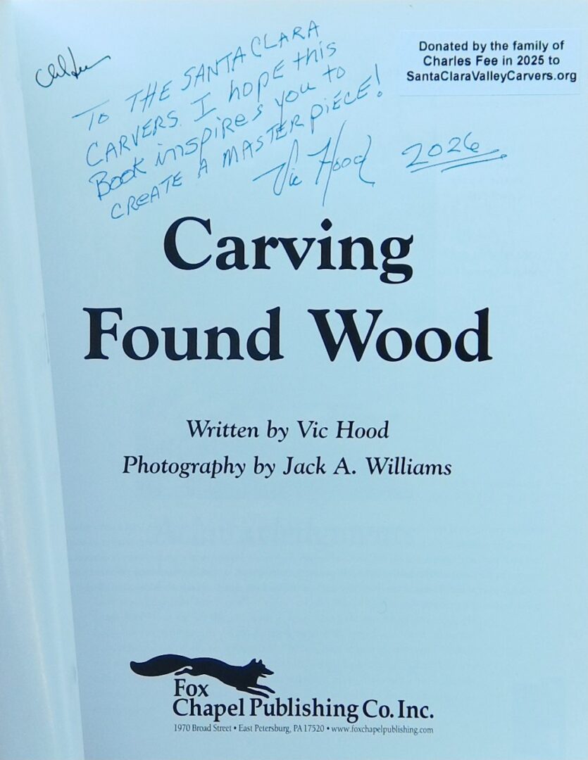 This book features a handwritten inscription addressed 'To the Santa Clara Carvers' from the author, Vic Hood, wishing inspiration for a masterpiece. It also includes a donation label indicating the book was donated by the family of Charles Fee in 2025 to SantaClaraValleyCarvers.org.