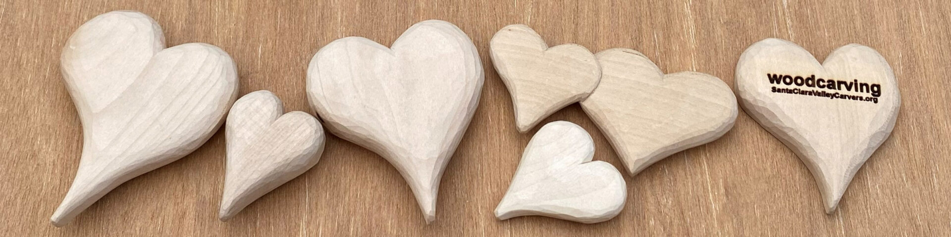 Several hand-carved hearts from basswood by Roman Chernikov