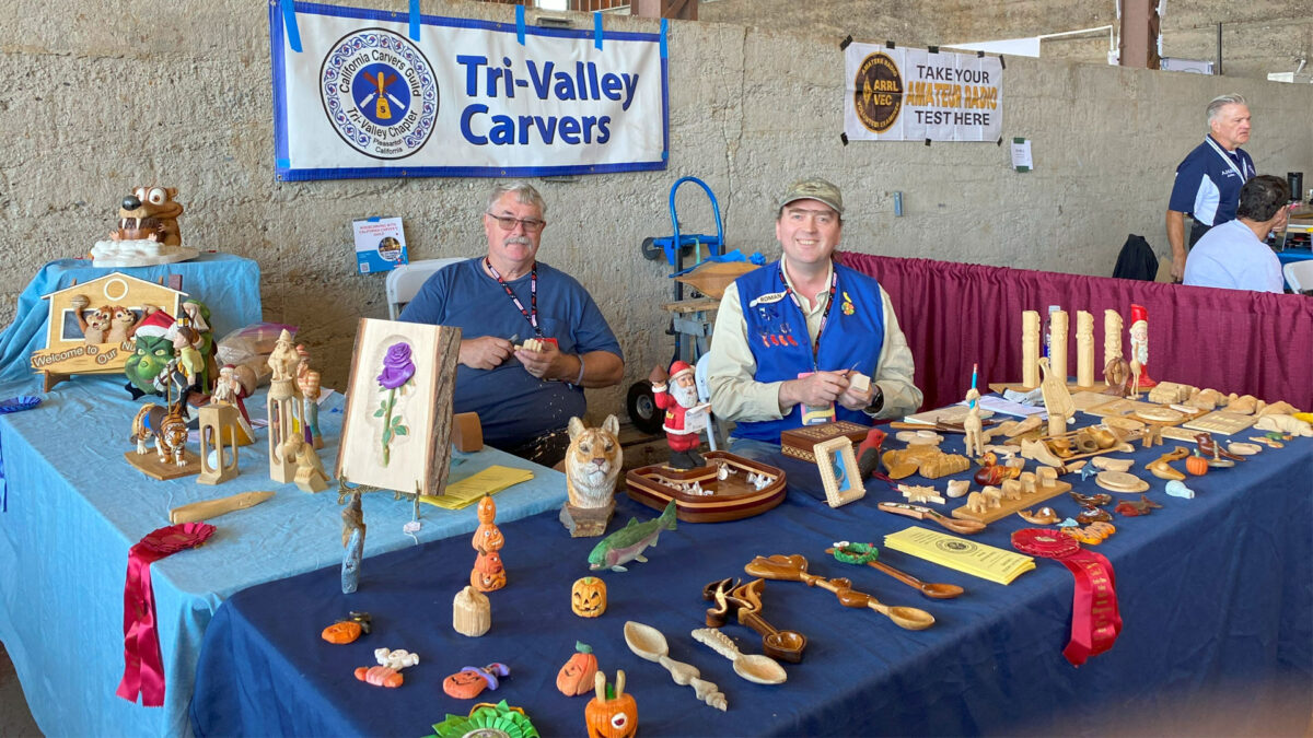 Ken Morgan and Roman Chernikov demonstrate woodcarving at Maker Faire