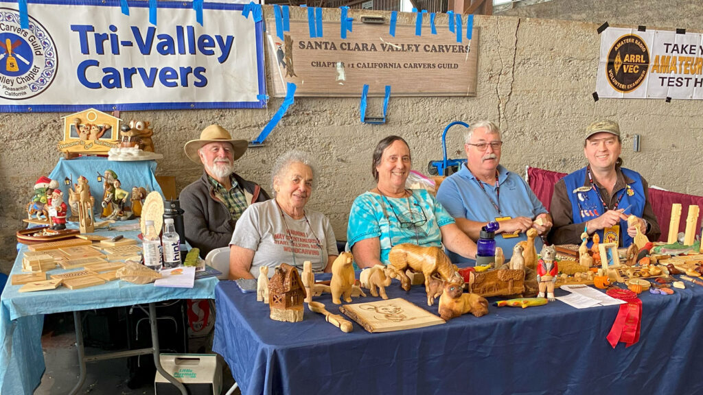 Woodcarving demonstration at Maker Faire. From left to right: Ed Heskett, Judy Hess, Theda Mobley, Ken Morgan, and Roman Chernikov.