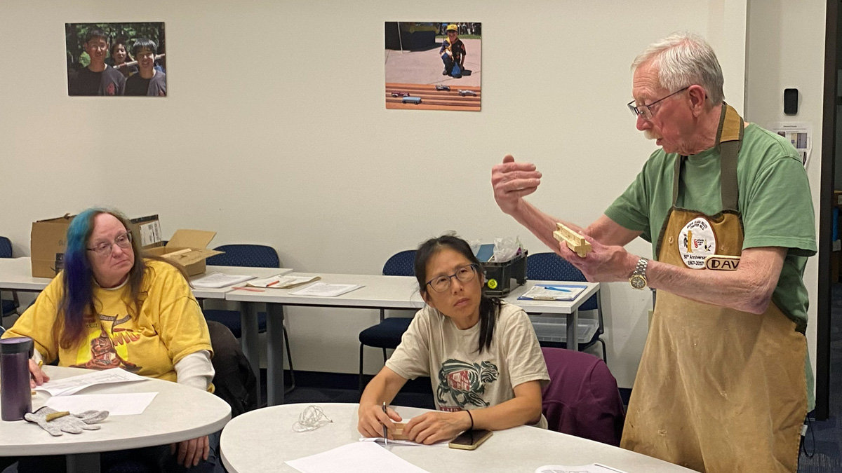 Dave explains how to carve a wooden chain from one block of wood at our chain-carving workshop in 2026.