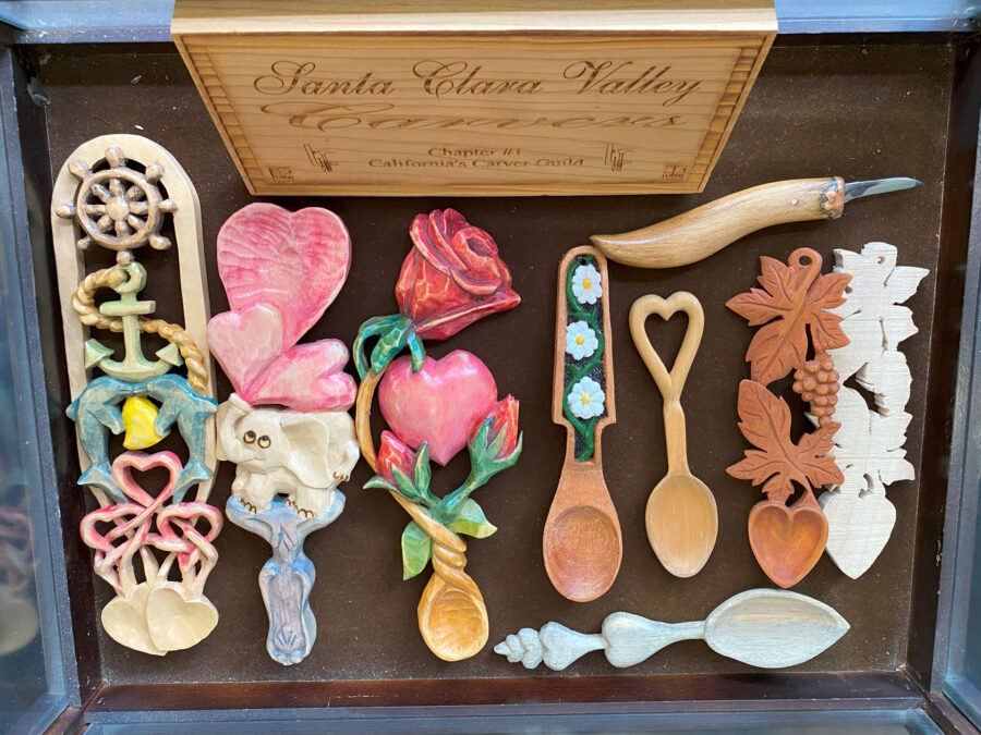 Display case with decorative spoons carved from basswood and butternut for the woodcarving newsletter. Contributors: Darryl Easter from Channel Islands Carvers, Scot Lang from Central Coast Wood Carvers, David Osterlund (SCVC), and David Clarke (SCVC).