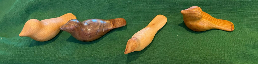 Gary Eaves displayed several comfort birds that he recently carved.