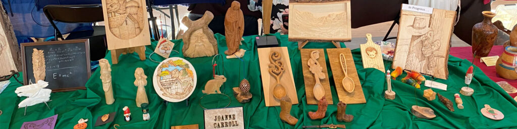 Joanne filled her table with a combination of woodcarving and pyrography projects at the 2025 TVC Woodcarving Show in Pleasanton, CA.