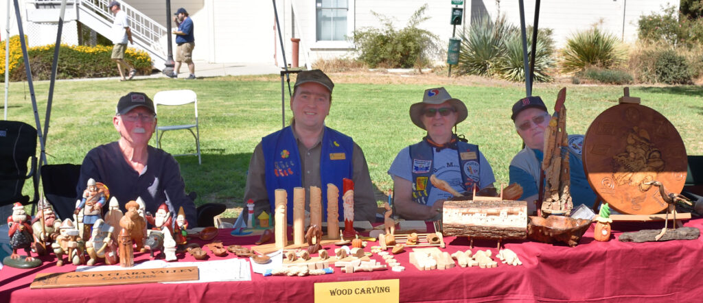 Presenting whittling and woodcarving at the History Park in San Jose, CA. September 2022. In the wood carving booth from left to right: David Osterlund, Roman Chernikov, Alan Huntzinger, Jim Phipps